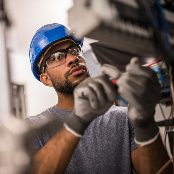 electrician in training working on a circuit board