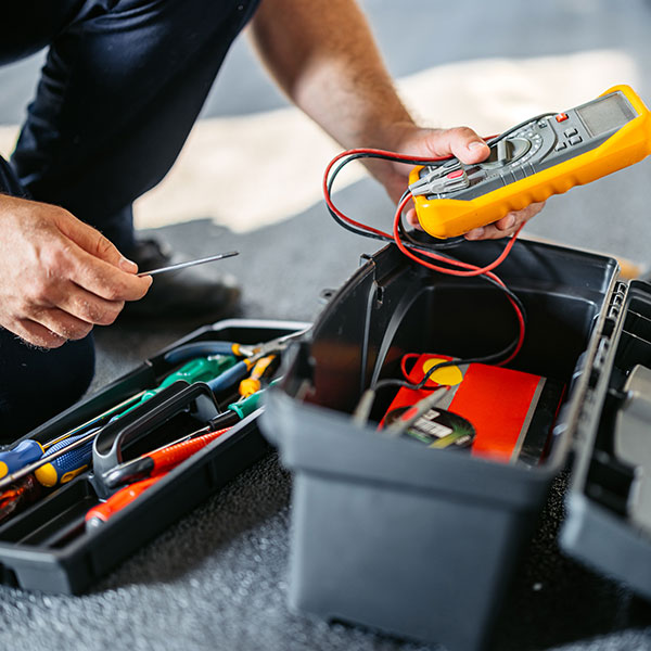 A man fixing an electrical box